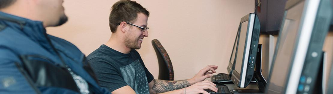 A student in a Pima Student Center works on a computer